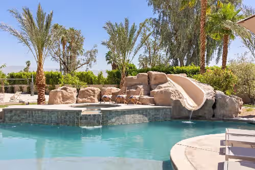Spacious pool with slide at Casa Mara