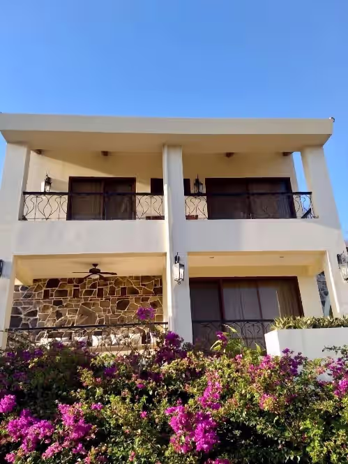 Main Bedrooms (Master Suite, 1st Floor; Junior and Bunk Room, 2nd Floor). at Walk to the Beach in Rancho Santana
