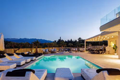 Beautifully lit during the evening at Pristine villa with spa, cinema room, full privacy, only 100 meters from sandy beach