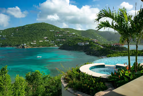 Sitting on balcony, overlooking exquisite Rendezvous Bay and Ditleff. at 2024 Winner Vrbo's Vacation Rental of the Year: