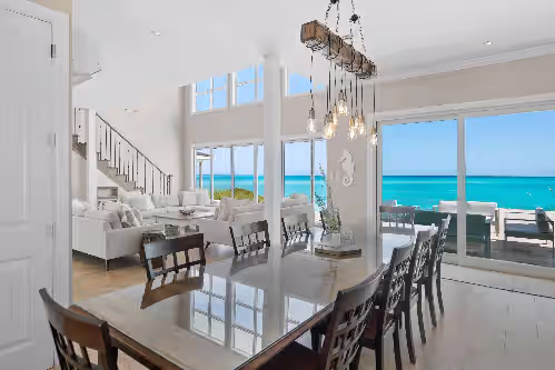 Dine with a stunning view at Shades of Blue a luxury home on private beachfront sleeps 20ppl, chef, boat tour