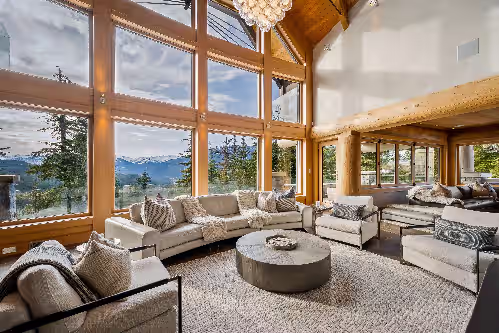Open plan main living room with wood-burning fireplace. at Panoramic Estate