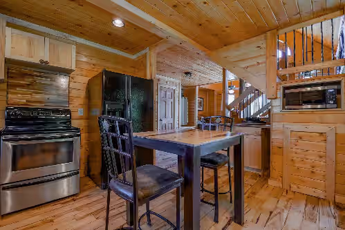 Kitchen has electric stove, full fridge, and microwave at Perfect for Family Reunions & Retreats!! Getaway to spectacular