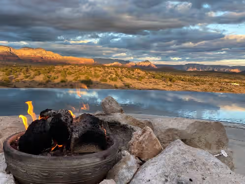 - Fiery outdoor ambiance overlooking sweeping desert and canyon scenery - Cozy seating invites warm conversations beside