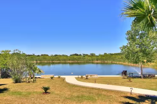 Catfish pond when full at Two Cozy Cabins Located On 65 Acre Longhorn Ranch