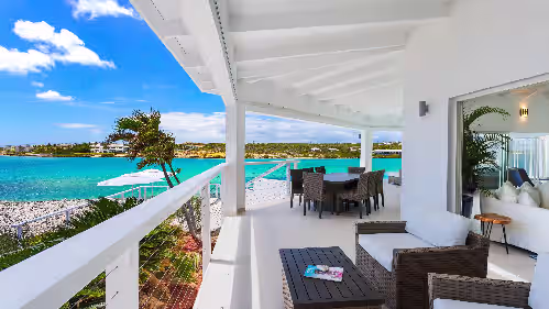 Outdoor dining at Stunning 6 bedroom waterfront villa with wooden dock