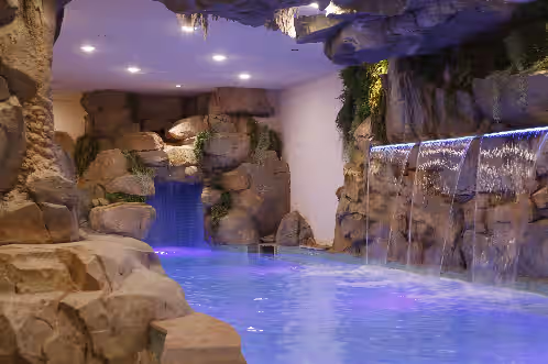 Indigo Falls ~ 8BR w/Golf Simulator, Indoor Cave Pool, Hot Tub, Game Room, Theater, & Views!