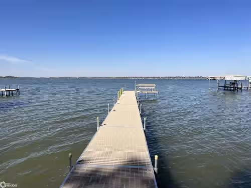 Enjoy this beach front lake home that boasts 66' of frontage with many amenities