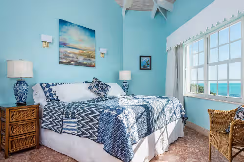 Guest house king size bed, can be split 2 twinsXL overlooks the ocean,has ensuit at Three Dolphins Villa