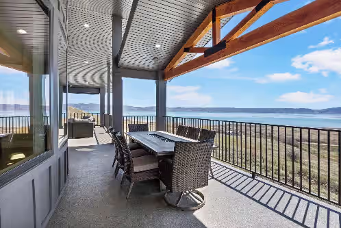 Upper balcony table with fire pit at Private pool, hot tub, indoor basketball court, massive indoor slide, and VIEWS