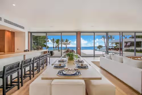 Caleton 24: Dining room with bar and lounge area at Caleton 24: Amazing ocean front villa w/ beach, pool, full staff & golf