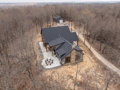 Exterior at Scenic River Front Lodge With A Fire Pit And Outdoor Kitchen