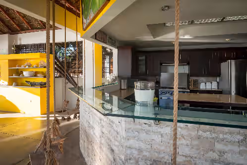 The Chef can participate in the conversation with the open concept kitchen at On the sands of Playa Marsella, 7bdrm sleeps