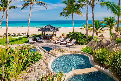 Gorgeous patio with pool and beachfront at Villa las Rocas: One-Of-A-Kind Lush Tropical Mexican Beachfront Estate 7 BR