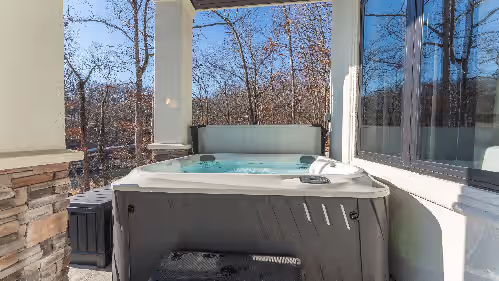 Outdoor spa tub at Modern Luxury! Sleeps 24! Pool, Spa, Golf, Arcade, Dock! Deep Cove, Calm Waters