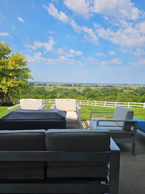 Terrace/patio at Family-Friendly Nebraska Estate with Scenic Pool, Gym, Theater & Fire Pit Fun