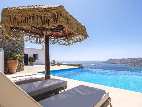 Pool sun beds at An Elegant Beachfront Luxury Retreat with Pool, Jacuzzi, 8 bedrooms