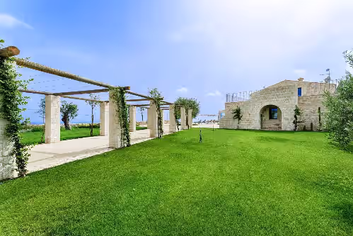 Property grounds at Panoramic villa for groups: garden, large infinity pool, large veranda