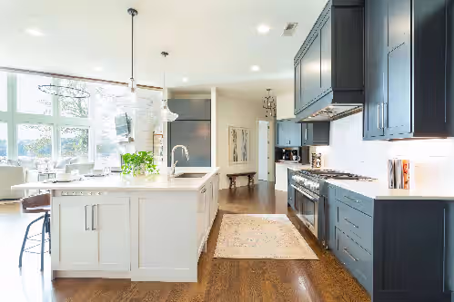 Entering the kitchen at Gorgeous Estate w/180 views of the lake and 300+ ft of waterfront