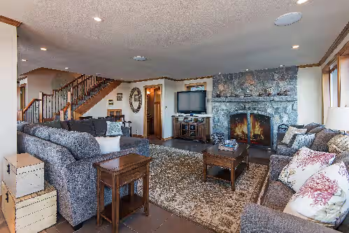 Wood burning fireplace at 6 BDRM OCEAN FRONT WITH AMAZING VIEWS, HOT TUB, WIFI Sleeps 16, beach access