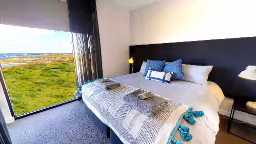 Bedroom 2 (may be separated into 2 king single beds) at Luxury Accommodation