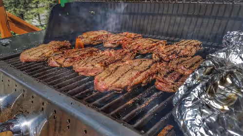 The back deck has both a gas and smoker grill. at The Lodge at Coliseum Mountain Resort