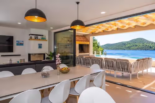 Amazing views from your kitchen and living area! Pool is devided by glass wall at Beachfront family paradise with pools &