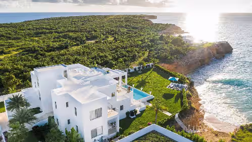 10,000 square feet of exquisite modern living with direct beach access