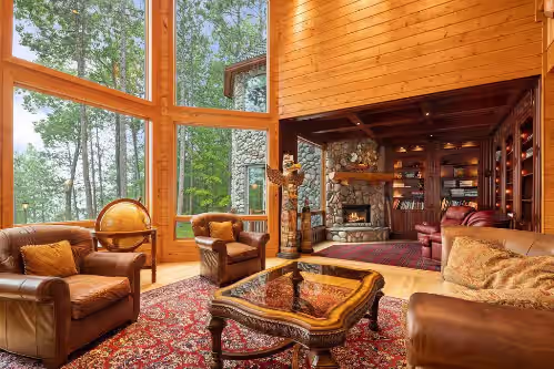 First floor living room & library main house at Luxurious 11,600 SQ' Mullett Lake Home & Carriage house,Private on Mullett
