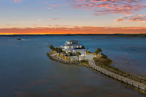 Luxurious private island home with pool, wraparound deck, & firepit