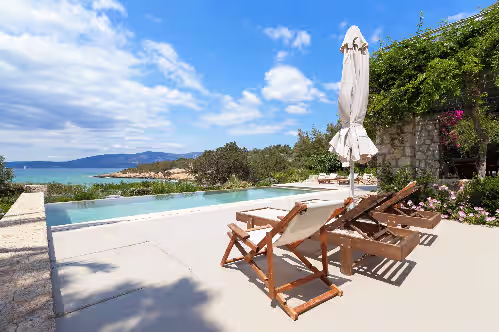Infinity pool with breathtaking sea views at this tranquil villa retreat. at Exclusive Beachfront Villa with Swimming pool
