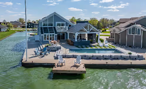 Lake front 4-bedroom vacation home with pool and tiki bar!