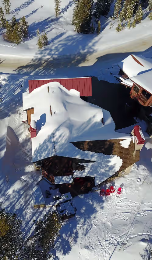 Drone pic ski slope (south) elevation at TRUE SKI-IN/SKI-OUT; ELEVATOR; 6BR; HOT TUB; SKI ROOM; GAME ROOM; MEDIA ROOM